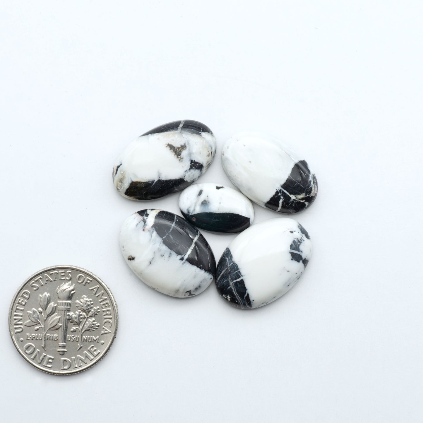 Natural White Buffalo Stone Cabochons are semi-precious gemstones cut into shapes ideal for jewelry-making, making them an excellent choice for artisans.