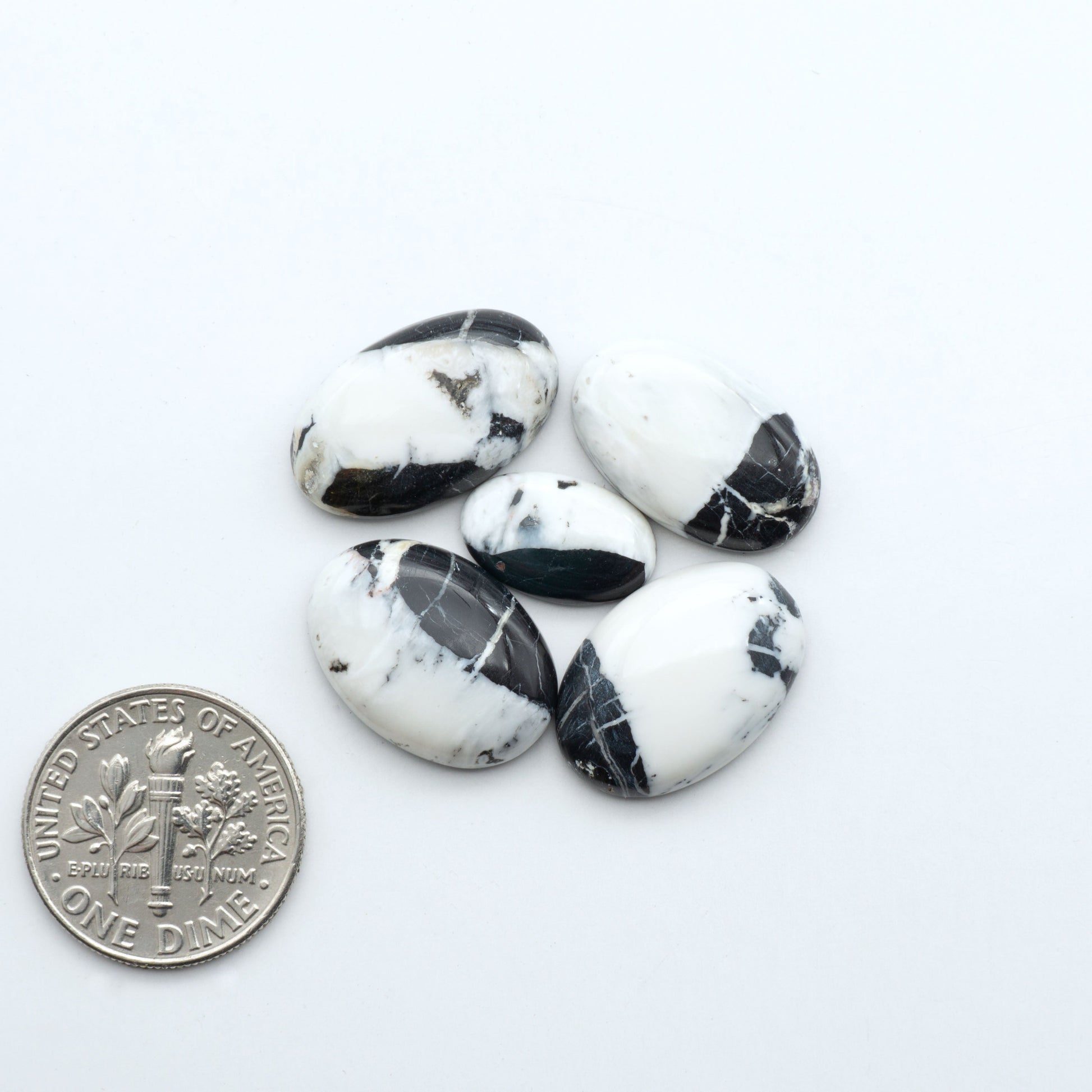 Natural White Buffalo Stone Cabochons are semi-precious gemstones cut into shapes ideal for jewelry-making, making them an excellent choice for artisans.
