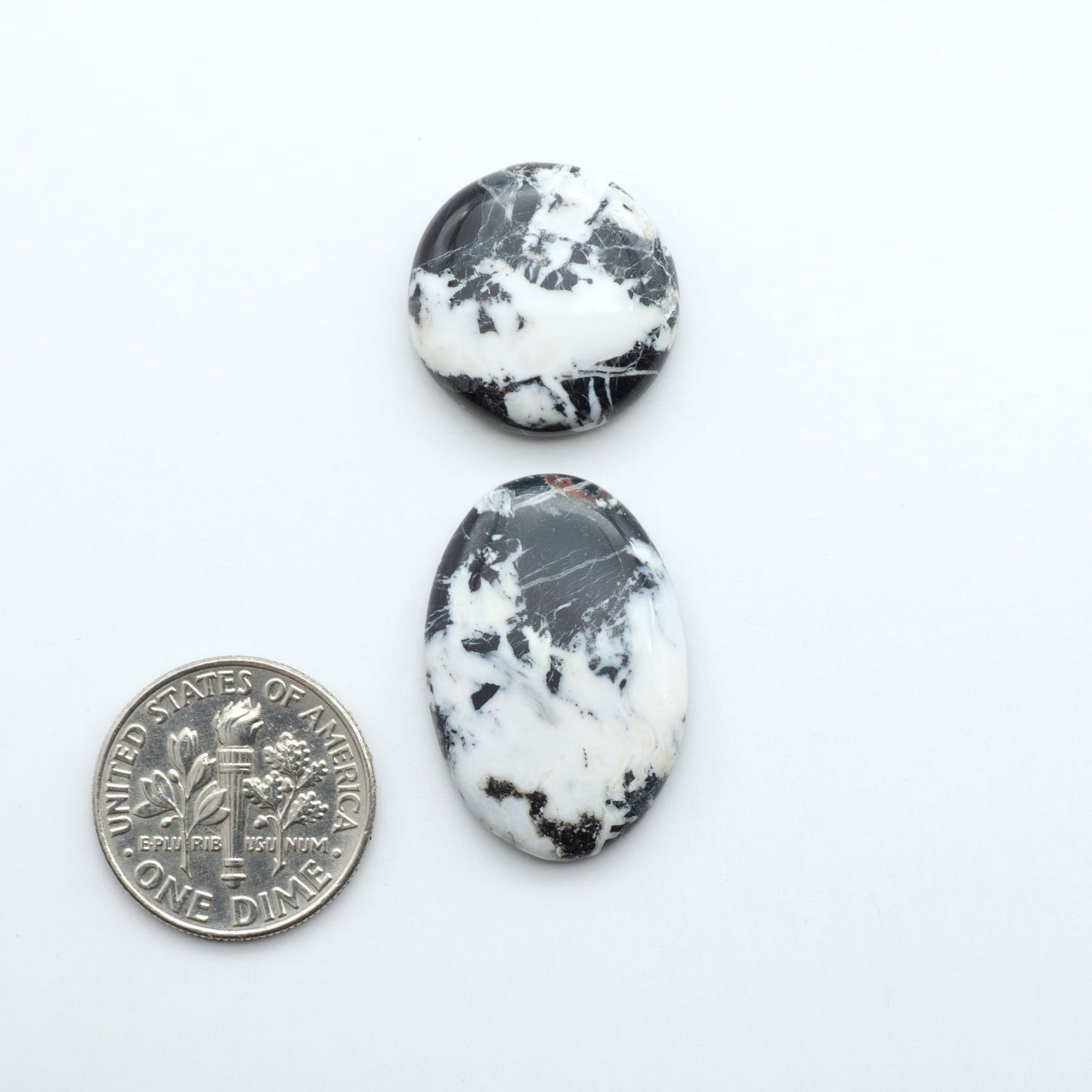 Natural White Buffalo Stone Cabochons are semi-precious gemstones cut into shapes ideal for jewelry-making, making them an excellent choice for artisans.