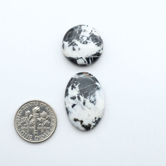Natural White Buffalo Stone Cabochons are semi-precious gemstones cut into shapes ideal for jewelry-making, making them an excellent choice for artisans.