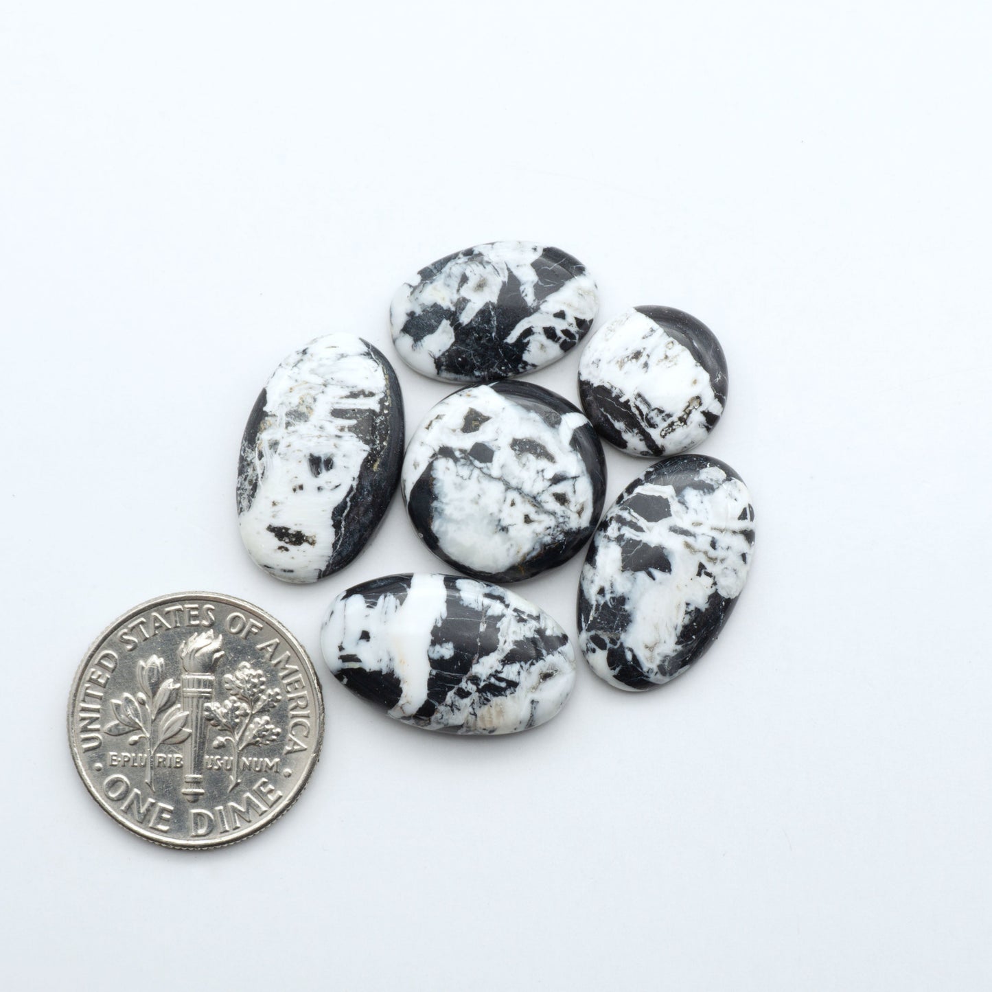 Natural White Buffalo Stone Cabochons are semi-precious gemstones cut into shapes ideal for jewelry-making, making them an excellent choice for artisans.