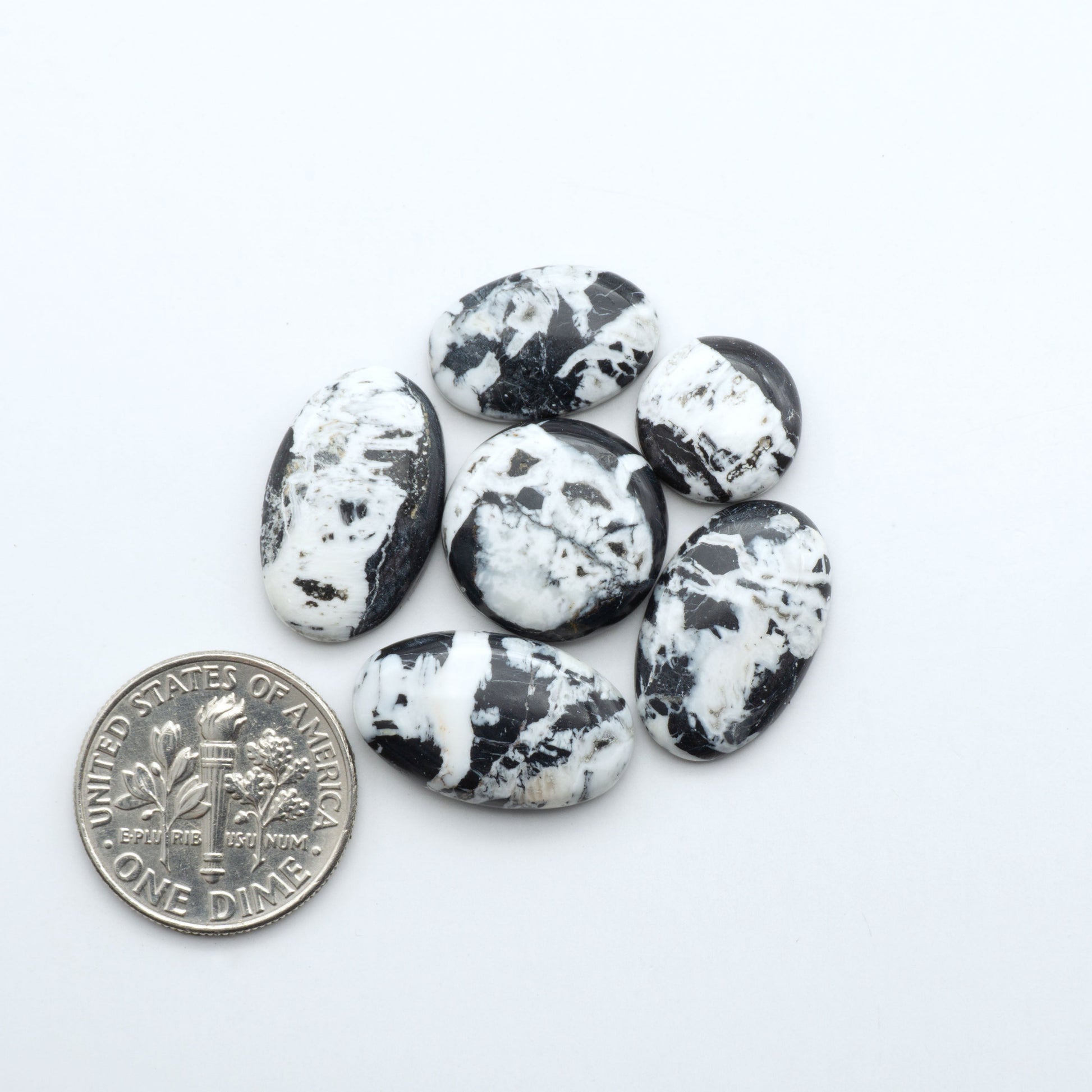 Natural White Buffalo Stone Cabochons are semi-precious gemstones cut into shapes ideal for jewelry-making, making them an excellent choice for artisans.