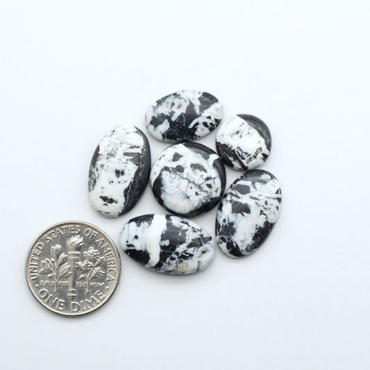 Natural White Buffalo Stone Cabochons are semi-precious gemstones cut into shapes ideal for jewelry-making, making them an excellent choice for artisans.