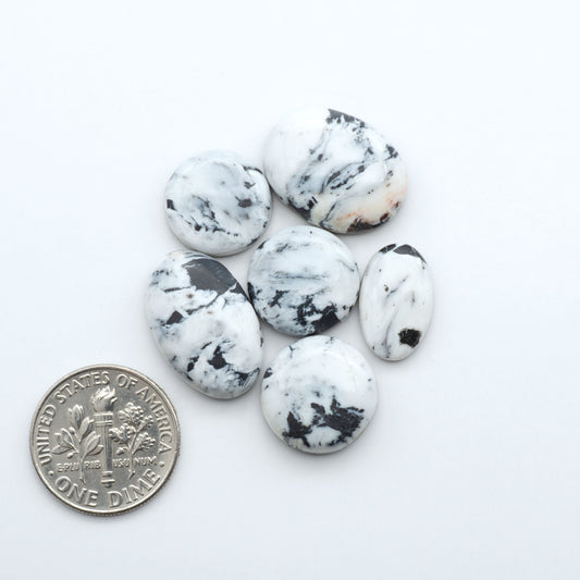 Natural White Buffalo Stone Cabochons are semi-precious gemstones cut into shapes ideal for jewelry-making, making them an excellent choice for artisans.