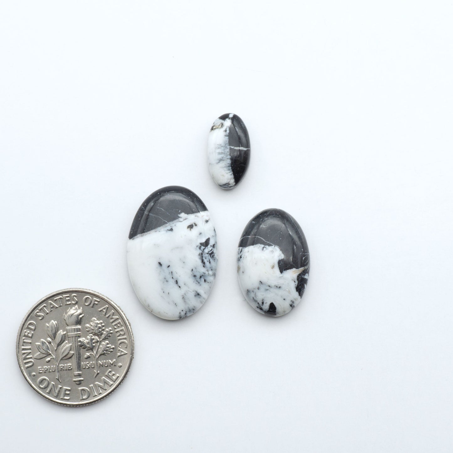 Natural White Buffalo Stone Cabochons are semi-precious gemstones cut into shapes ideal for jewelry-making, making them an excellent choice for artisans.