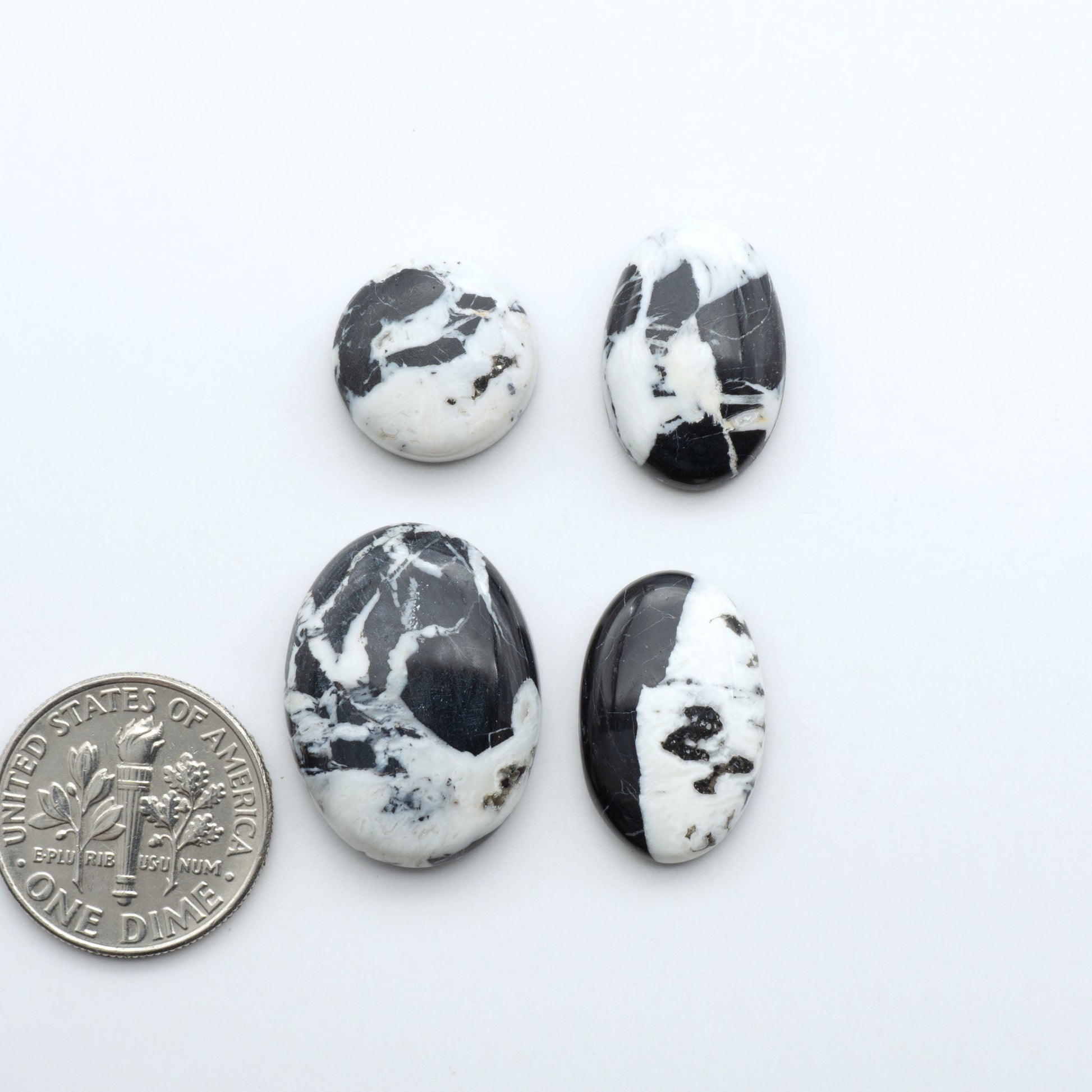 Natural White Buffalo Stone Cabochons are semi-precious gemstones cut into shapes ideal for jewelry-making, making them an excellent choice for artisans.
