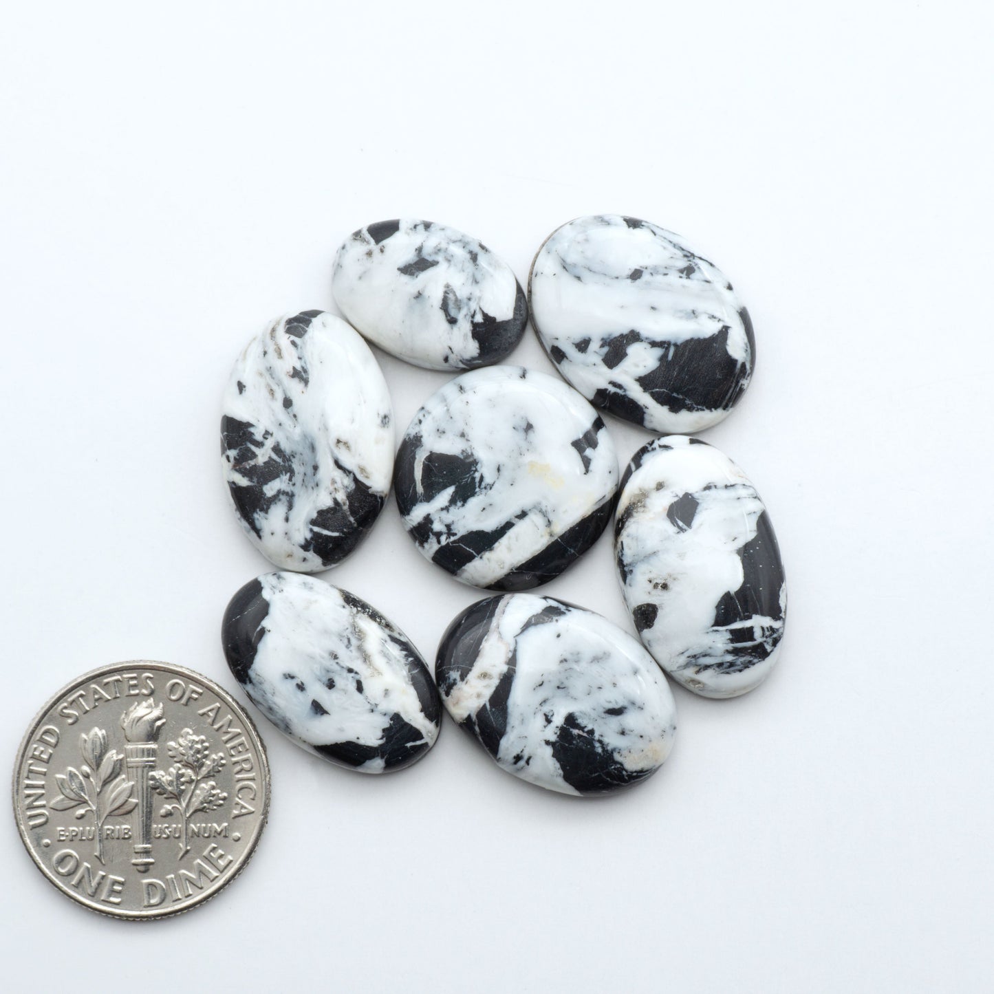 Natural White Buffalo Stone Cabochons are semi-precious gemstones cut into shapes ideal for jewelry-making, making them an excellent choice for artisans.