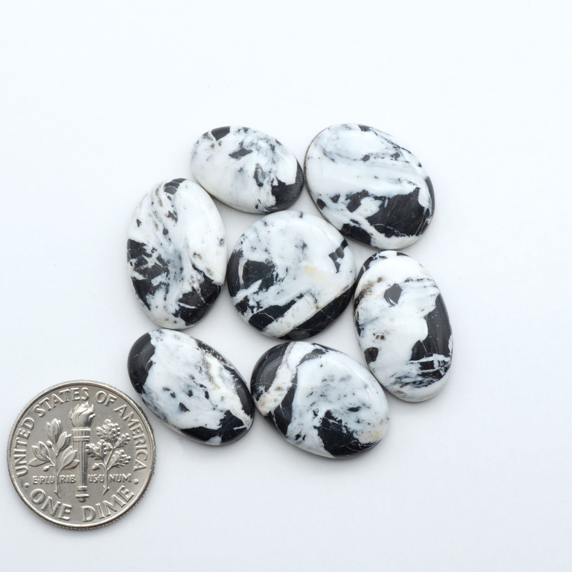 Natural White Buffalo Stone Cabochons are semi-precious gemstones cut into shapes ideal for jewelry-making, making them an excellent choice for artisans.