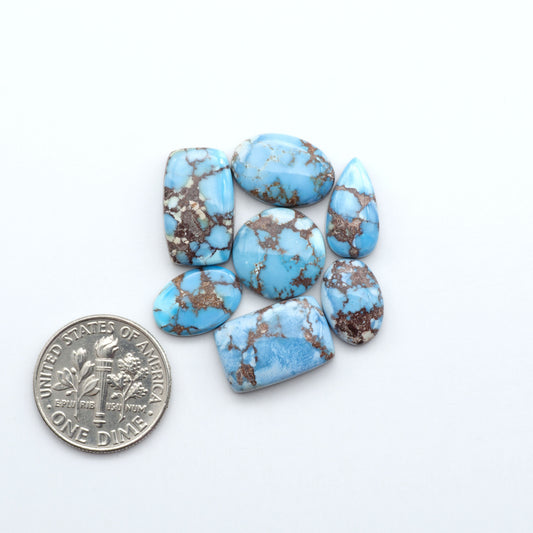 Discover the beauty of Natural Golden Hills Turquoise—prized for its icy blue tones, golden matrix, and exceptional quality. Ideal for artisan jewelry designs.

