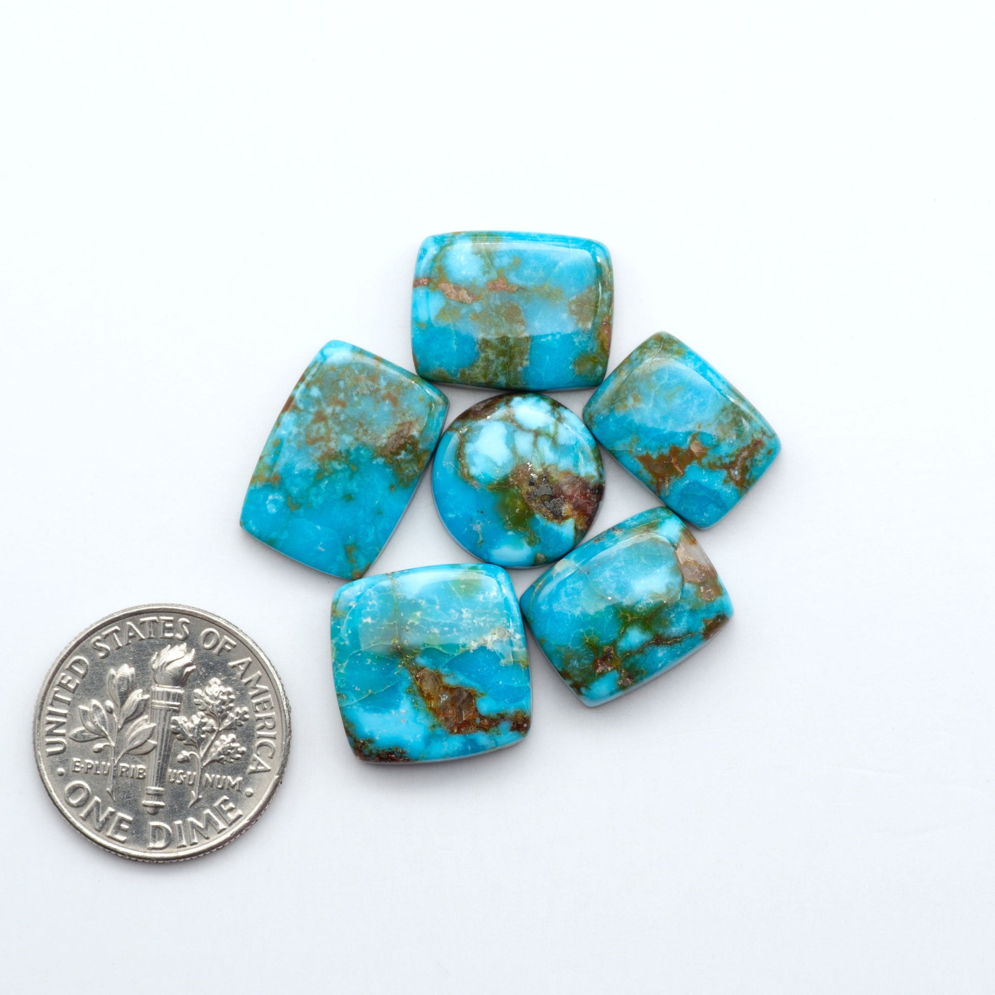 Kingman Turquoise Cabochons are a staple in the jewelry industry, known for their stunning blue-green color. Perfect for necklaces, earrings, and more!