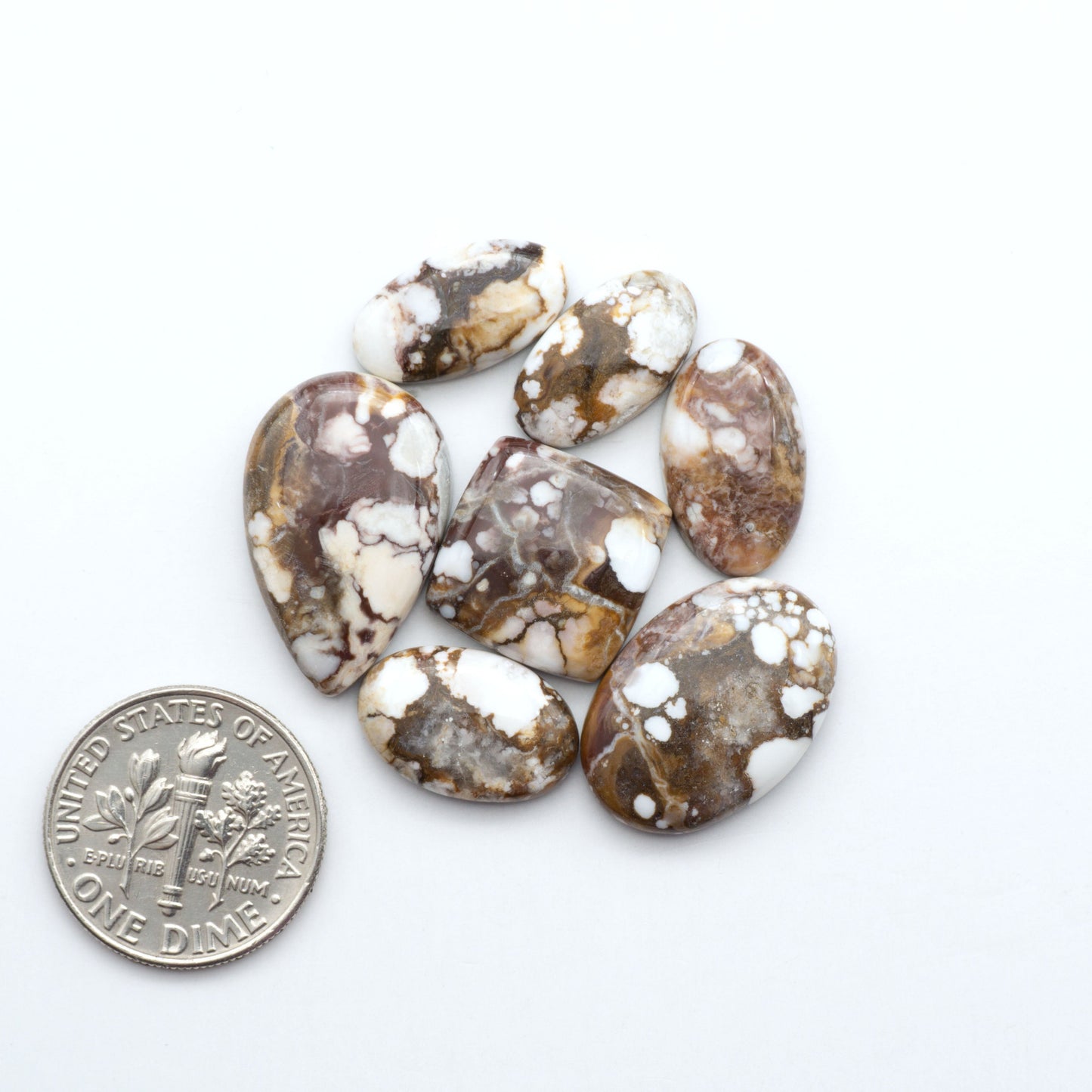 Enhance your jewelry designs with Pressed Turquoise Nugget Cabochons. Crafted from composite materials they add a captivating touch to your creations.