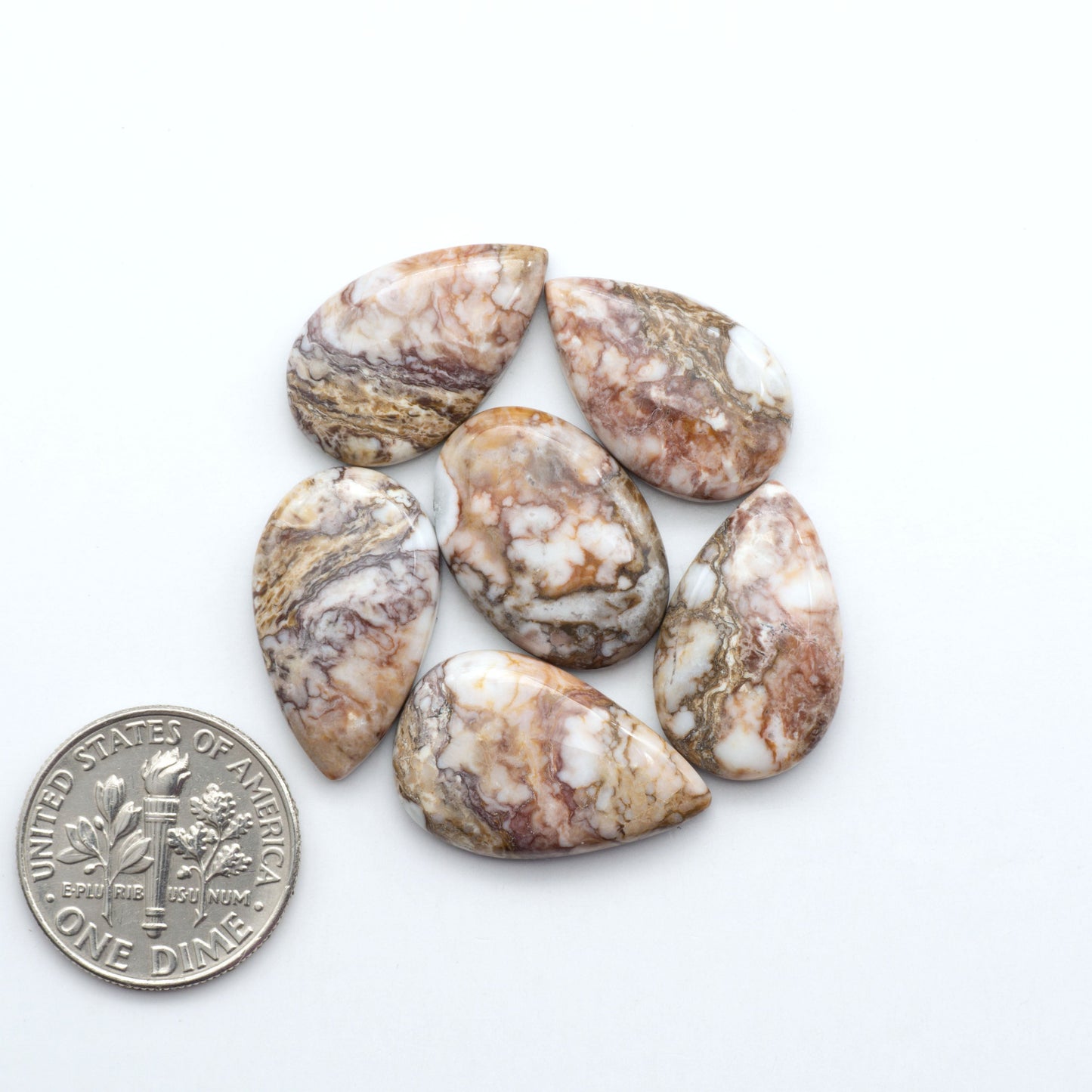 Enhance your jewelry designs with Pressed Turquoise Nugget Cabochons. Crafted from composite materials they add a captivating touch to your creations.