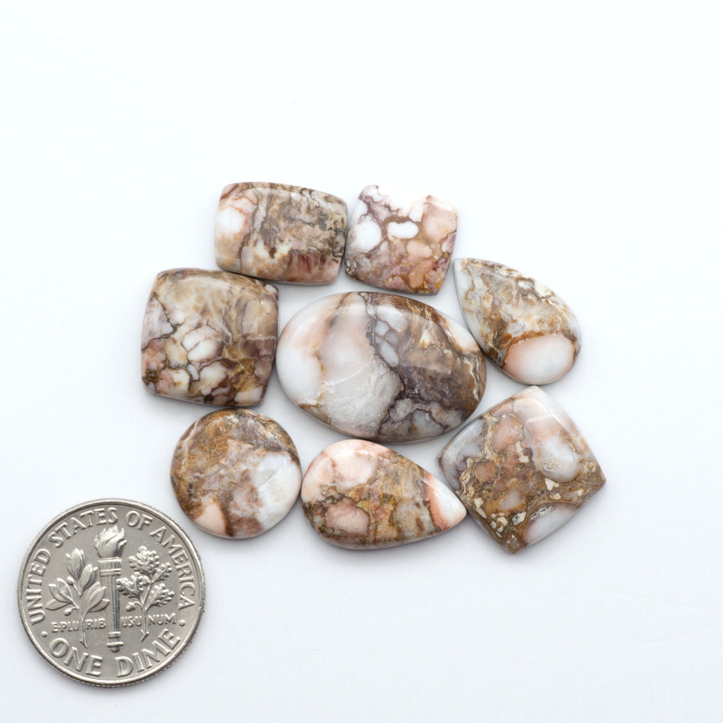 Enhance your jewelry designs with Pressed Turquoise Nugget Cabochons. Crafted from composite materials they add a captivating touch to your creations.