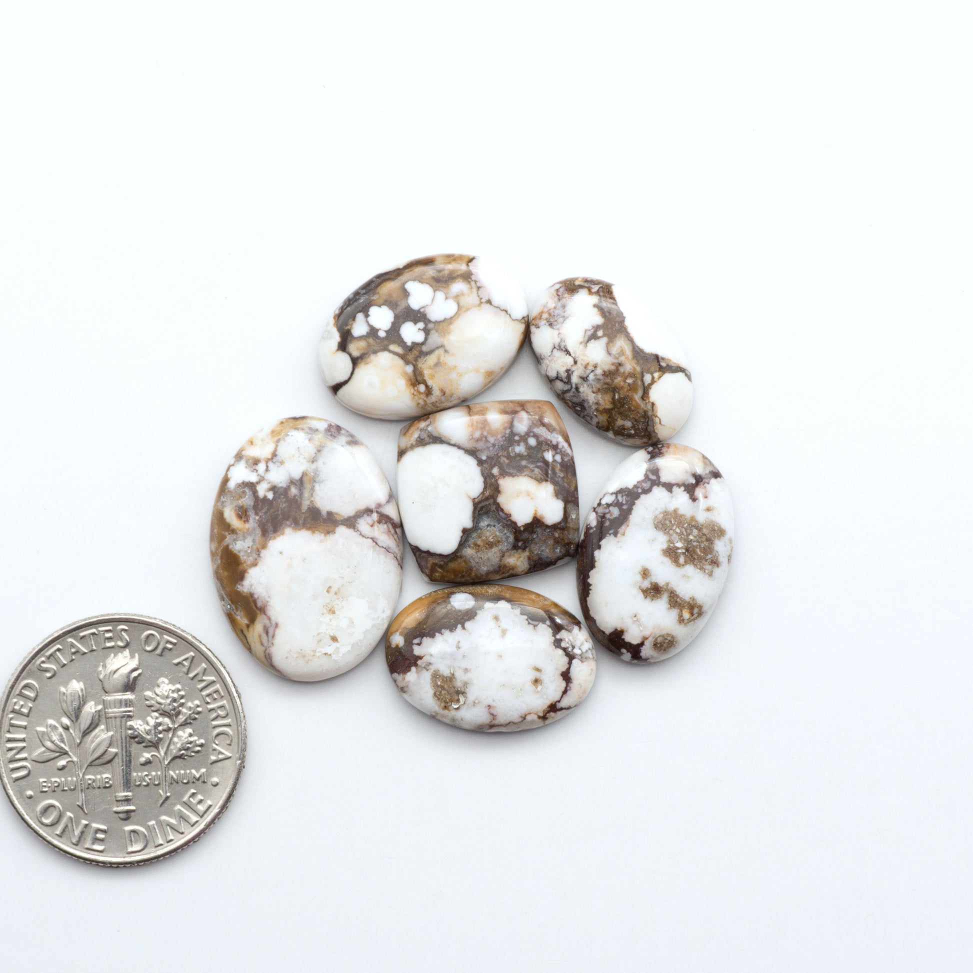 Enhance your jewelry designs with Pressed Turquoise Nugget Cabochons. Crafted from composite materials they add a captivating touch to your creations.