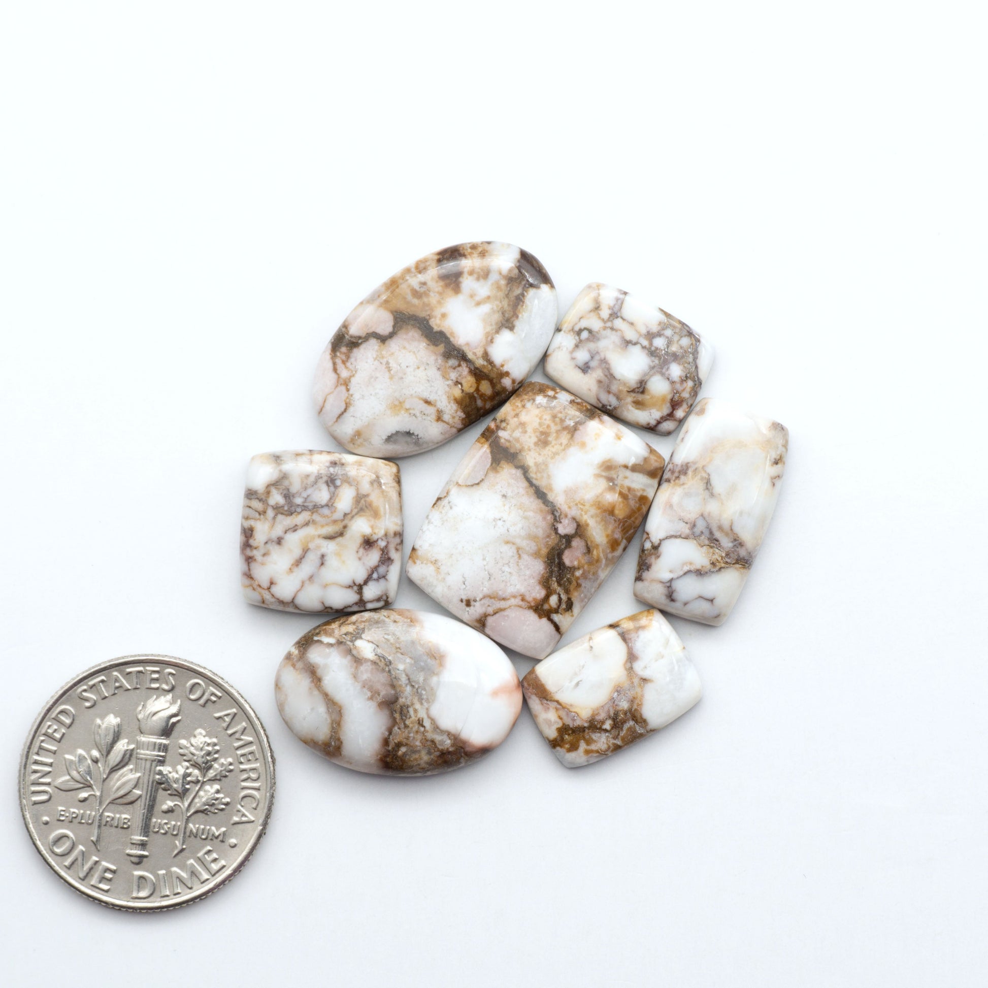 Enhance your jewelry designs with Pressed Turquoise Nugget Cabochons. Crafted from composite materials they add a captivating touch to your creations.