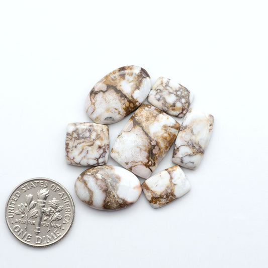 Enhance your jewelry designs with Pressed Turquoise Nugget Cabochons. Crafted from composite materials they add a captivating touch to your creations.