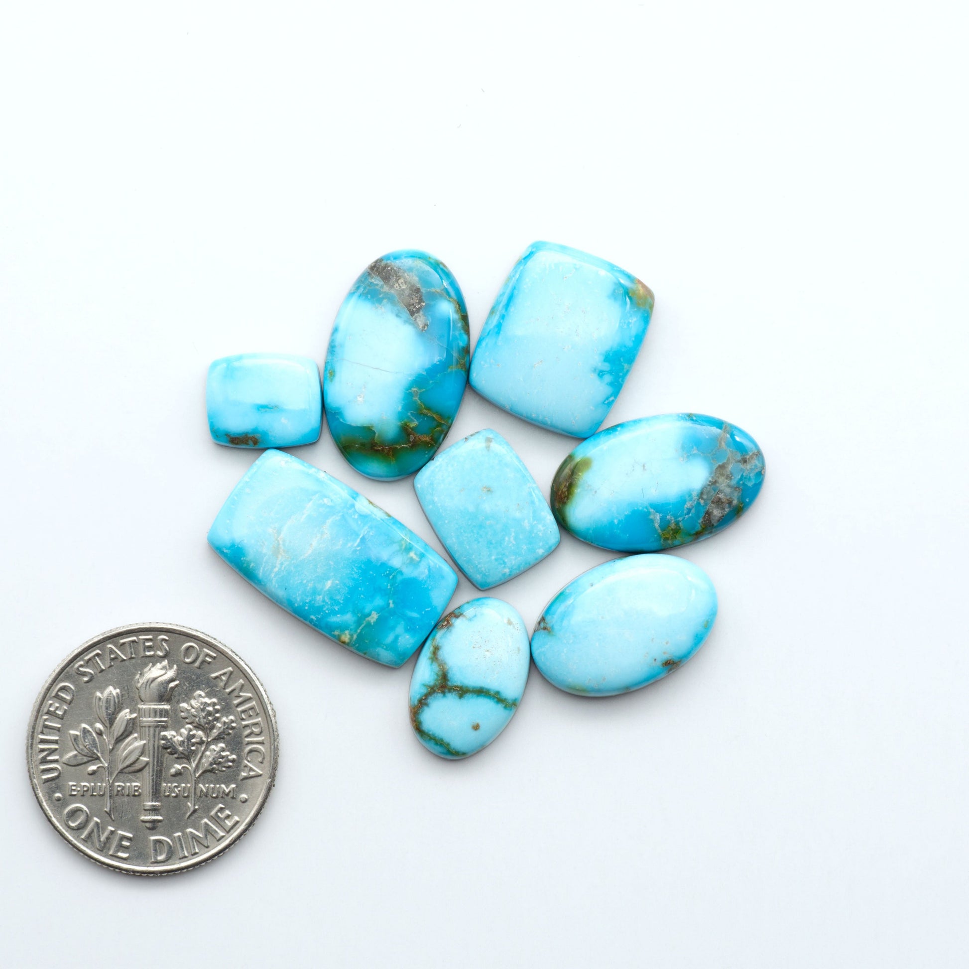 Kingman Turquoise Cabochons are a staple in the jewelry industry, known for their stunning blue-green color. Perfect for necklaces, earrings, and more!


