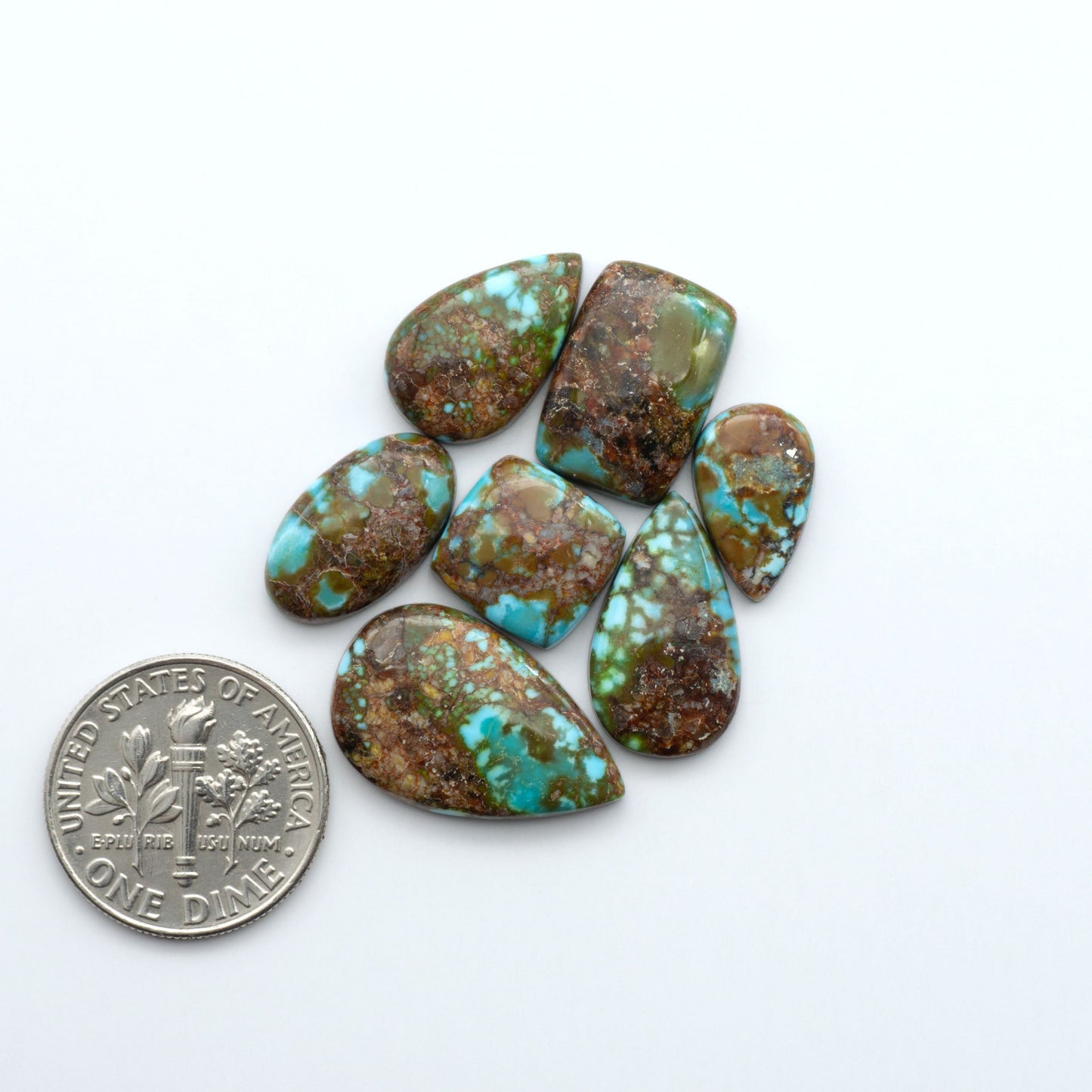 Kingman Turquoise Cabochons are a staple in the jewelry industry, known for their stunning blue-green color. Perfect for necklaces, earrings, and more!

