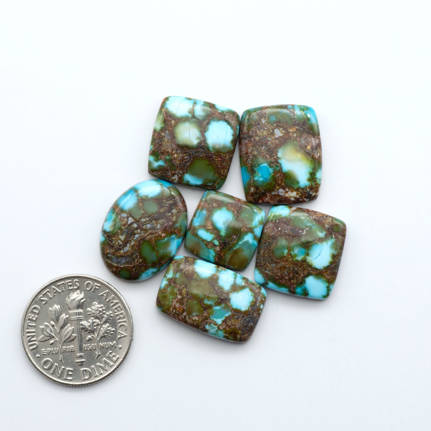 Kingman Turquoise Cabochons are a staple in the jewelry industry, known for their stunning blue-green color. Perfect for necklaces, earrings, and more!


