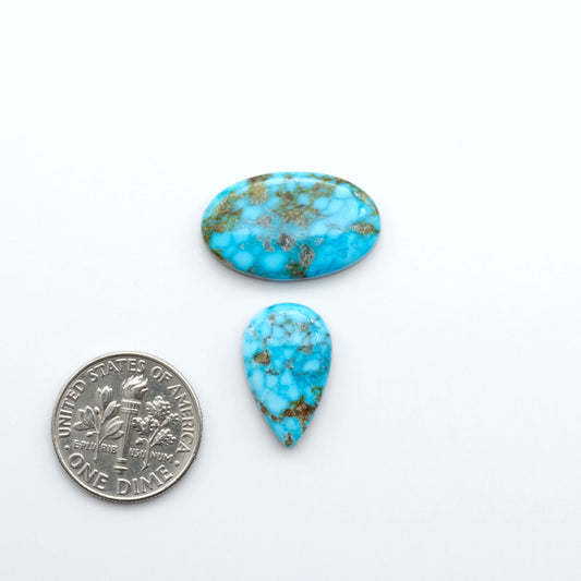 Kingman Turquoise Cabochons are a staple in the jewelry industry, known for their stunning blue-green color. Perfect for necklaces, earrings, and more!

