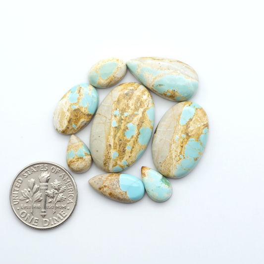 Royston Turquoise cabochons are famous for their distinctive matrix and unique green and blue hues, making them a favored option among jewelry designers.