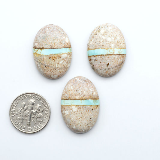 Royston Turquoise cabochons are famous for their distinctive matrix and unique green and blue hues, making them a favored option among jewelry designers.
