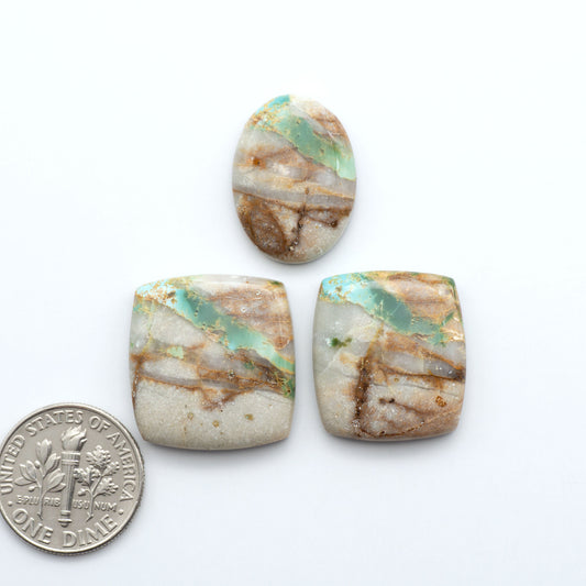 Royston Turquoise cabochons are famous for their distinctive matrix and unique green and blue hues, making them a favored option among jewelry designers.