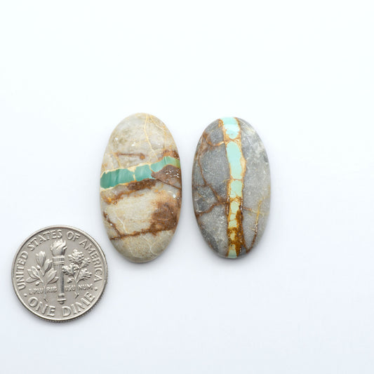 Royston Turquoise cabochons are famous for their distinctive matrix and unique green and blue hues, making them a favored option among jewelry designers.