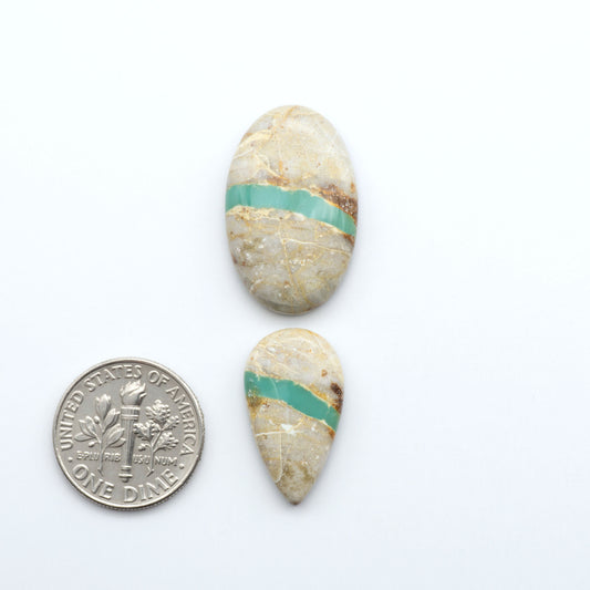 Royston Turquoise cabochons are famous for their distinctive matrix and unique green and blue hues, making them a favored option among jewelry designers.