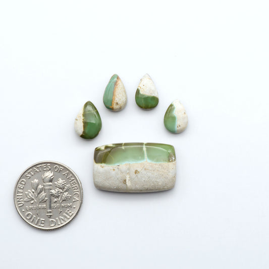 Royston Turquoise cabochons are famous for their distinctive matrix and unique green and blue hues, making them a favored option among jewelry designers.