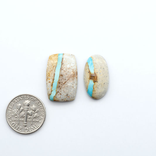 Royston Turquoise cabochons are famous for their distinctive matrix and unique green and blue hues, making them a favored option among jewelry designers.