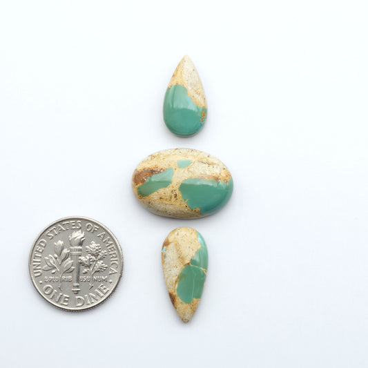 Royston Turquoise cabochons are famous for their distinctive matrix and unique green and blue hues, making them a favored option among jewelry designers.