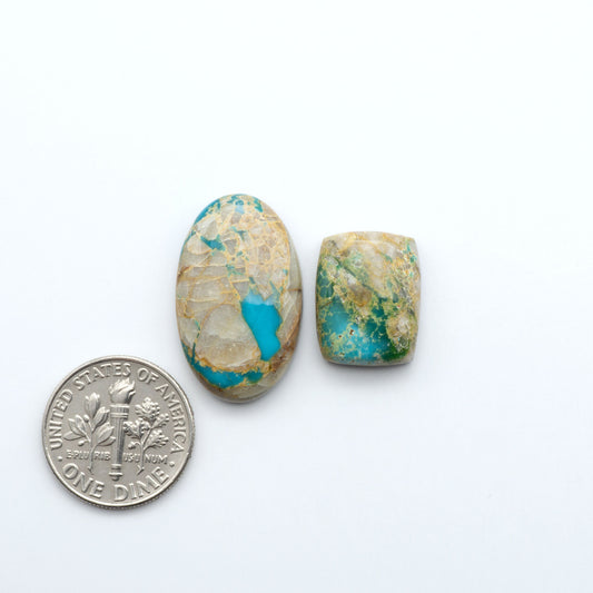 Royston Turquoise cabochons are famous for their distinctive matrix and unique green and blue hues, making them a favored option among jewelry designers.