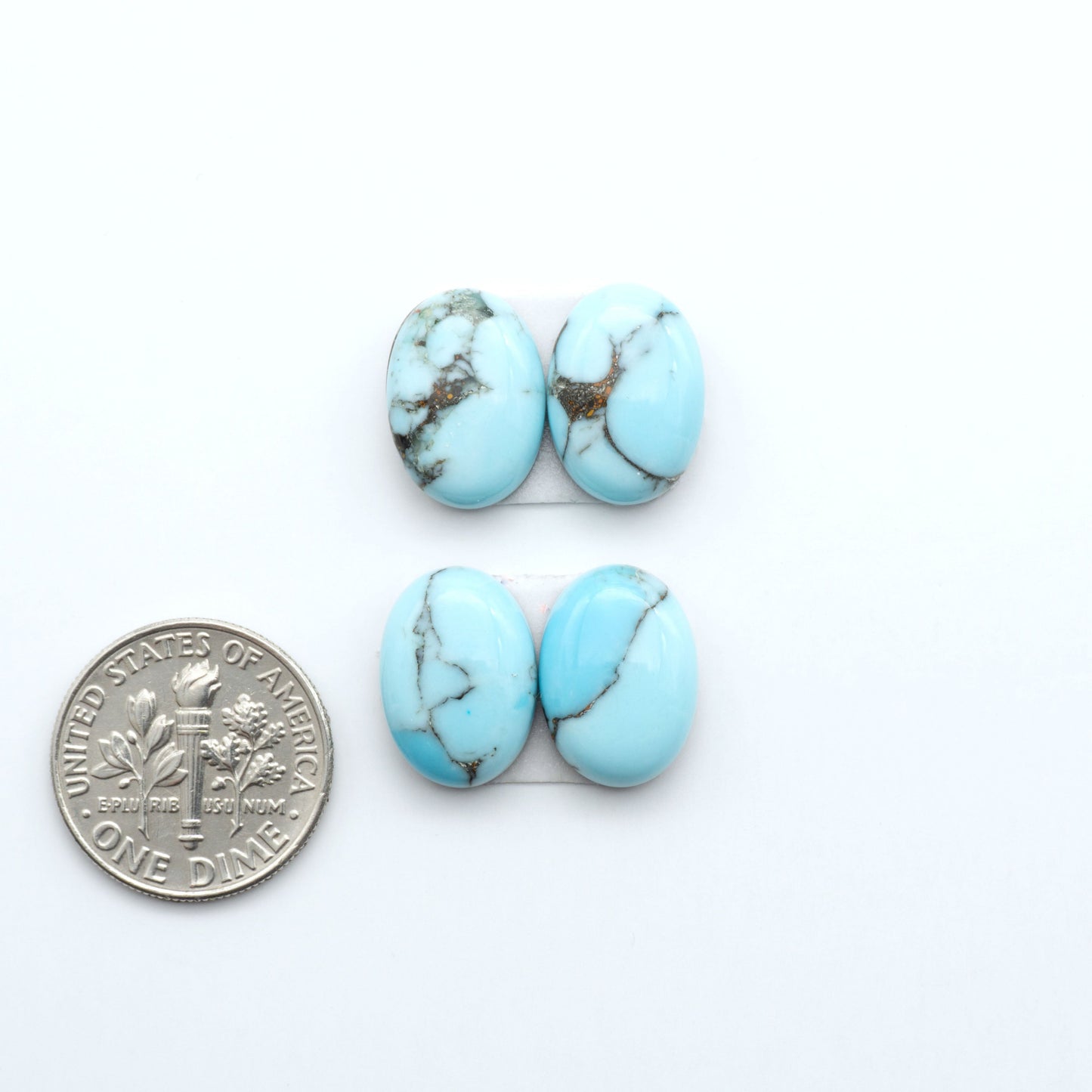 Enhance your jewelry designs with Pressed Turquoise Nugget Cabochons. Crafted from composite materials they add a captivating touch to your creations.