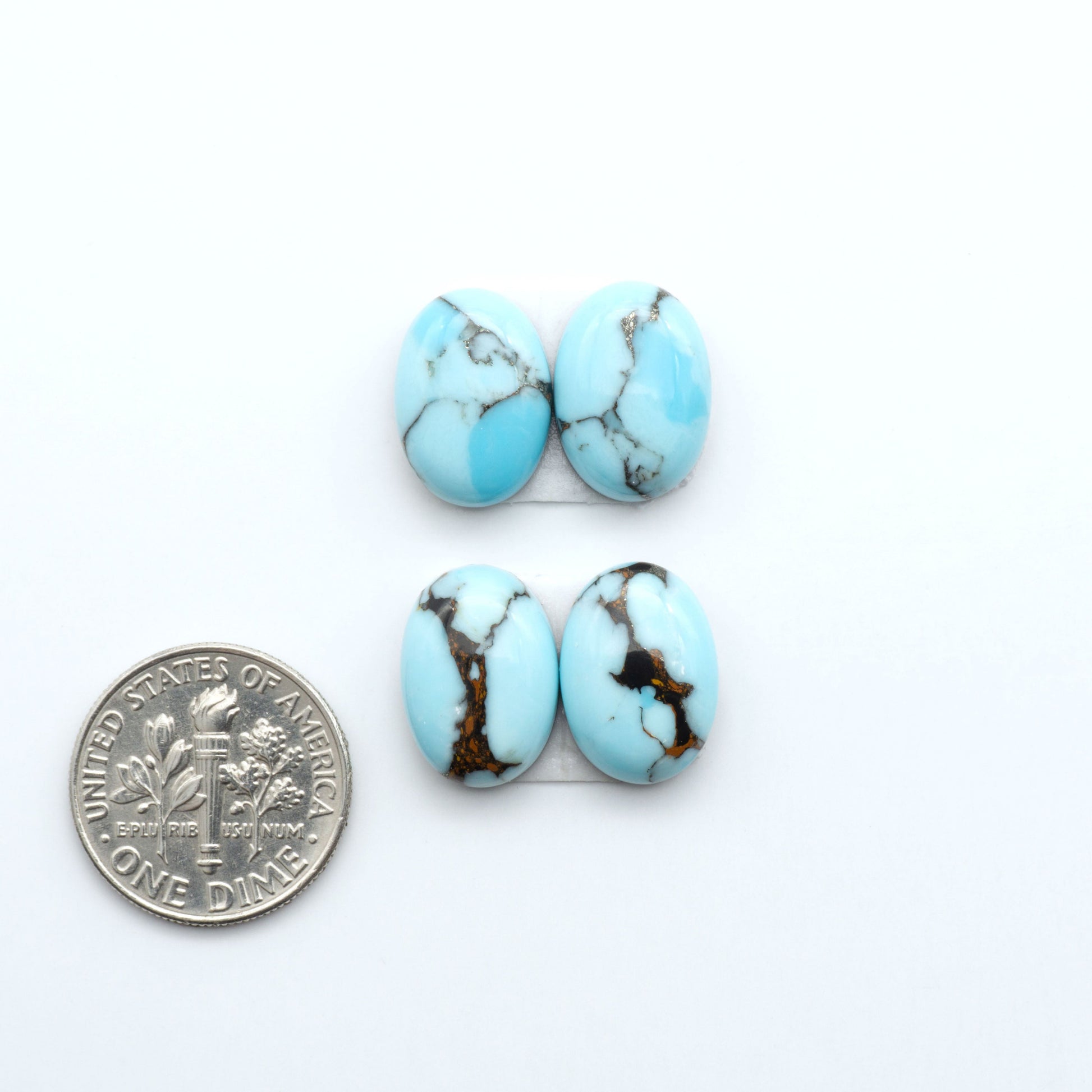 Enhance your jewelry designs with Pressed Turquoise Nugget Cabochons. Crafted from composite materials they add a captivating touch to your creations.