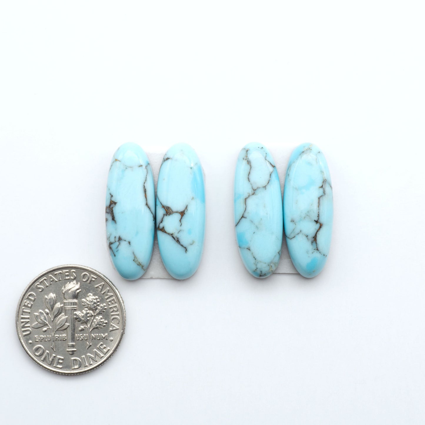 Enhance your jewelry designs with Pressed Turquoise Nugget Cabochons. Crafted from composite materials they add a captivating touch to your creations.