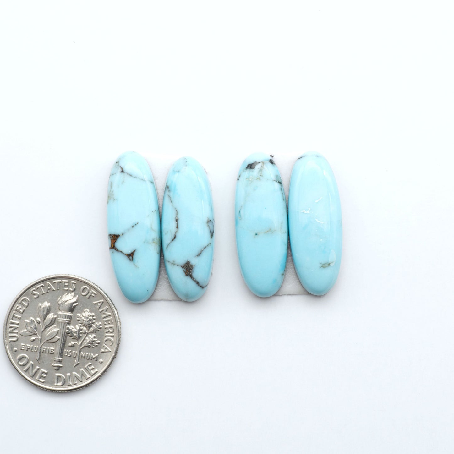 Enhance your jewelry designs with Pressed Turquoise Nugget Cabochons. Crafted from composite materials they add a captivating touch to your creations.