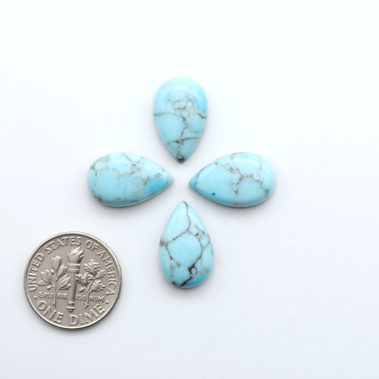 Enhance your jewelry designs with Pressed Turquoise Nugget Cabochons. Crafted from composite materials they add a captivating touch to your creations.