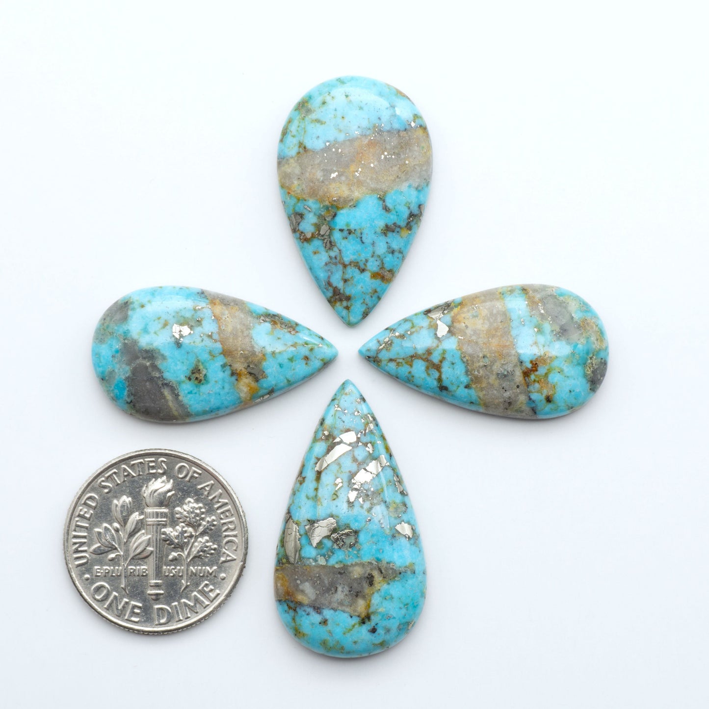 Nacozari turquoise cabochons are striking gemstones known for their vibrant blue to greenish-blue colors and pyrite, these stones are prized in jewelry making.