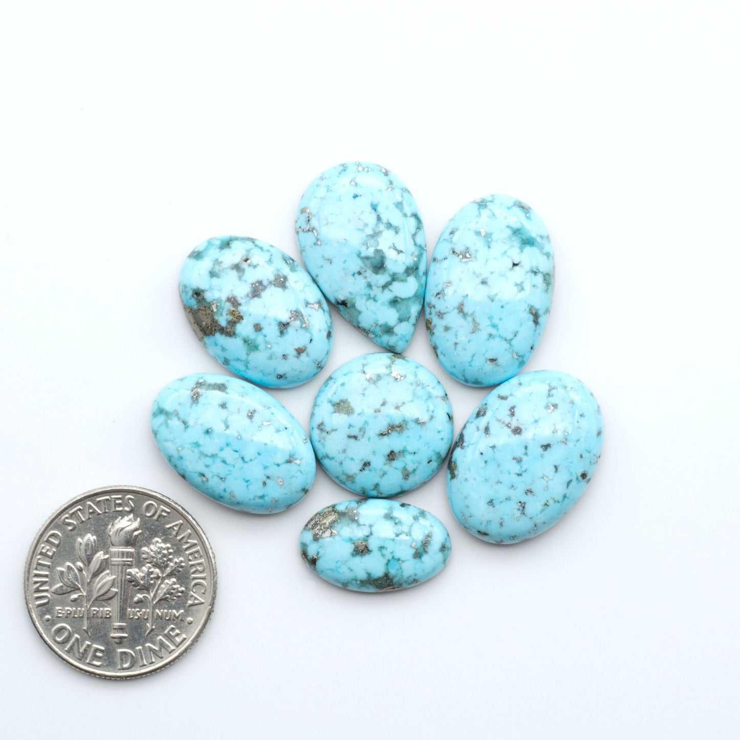 Nacozari turquoise cabochons are striking gemstones known for their vibrant blue to greenish-blue colors and pyrite, these stones are prized in jewelry making.