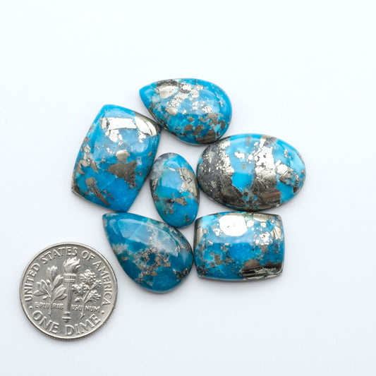 Nacozari turquoise cabochons are striking gemstones known for their vibrant blue to greenish-blue colors and pyrite, these stones are prized in jewelry making.
