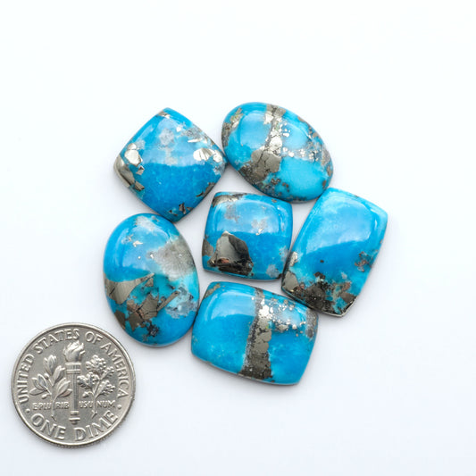 Nacozari turquoise cabochons are striking gemstones known for their vibrant blue to greenish-blue colors and pyrite, these stones are prized in jewelry making.