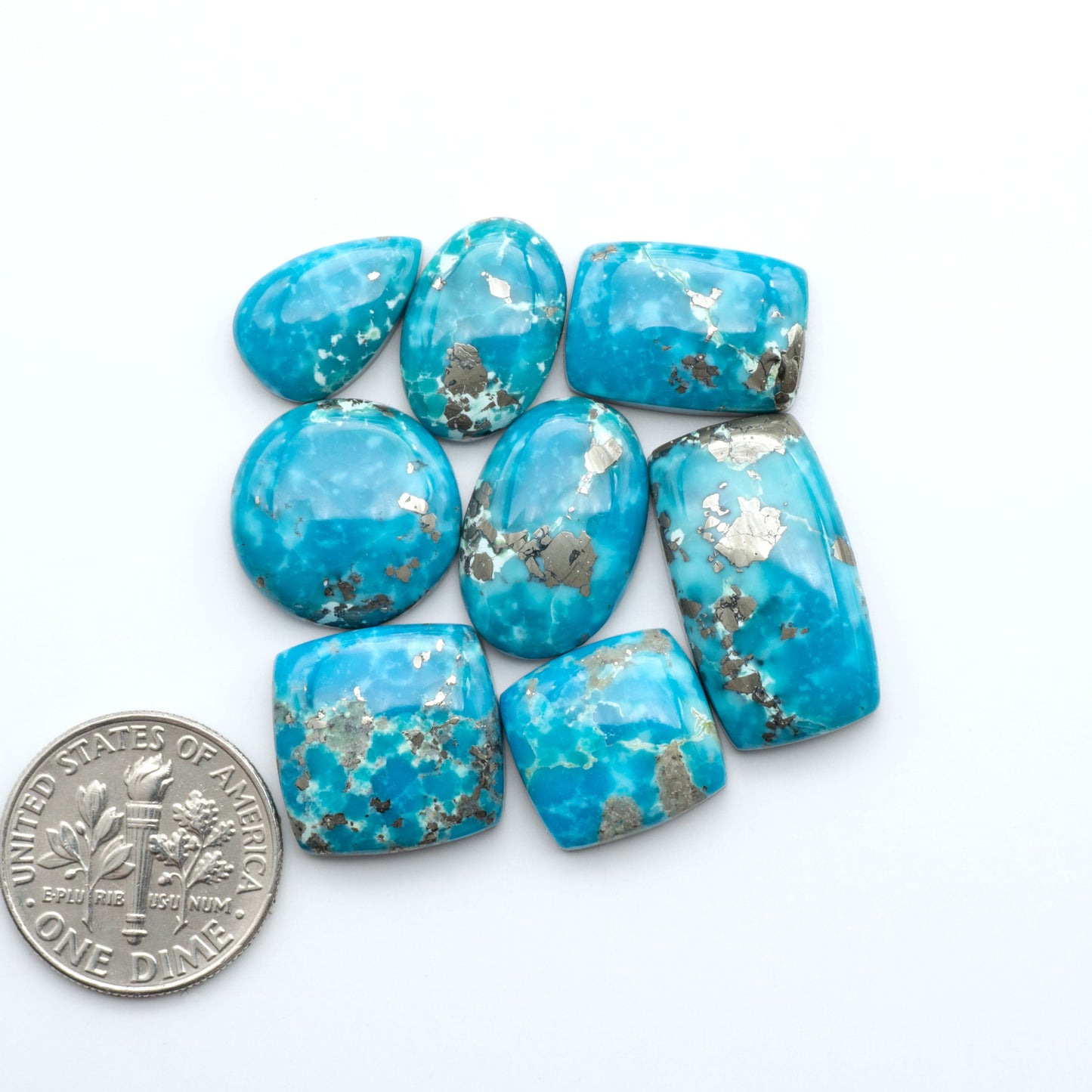 Nacozari turquoise cabochons are striking gemstones known for their vibrant blue to greenish-blue colors and pyrite, these stones are prized in jewelry making.