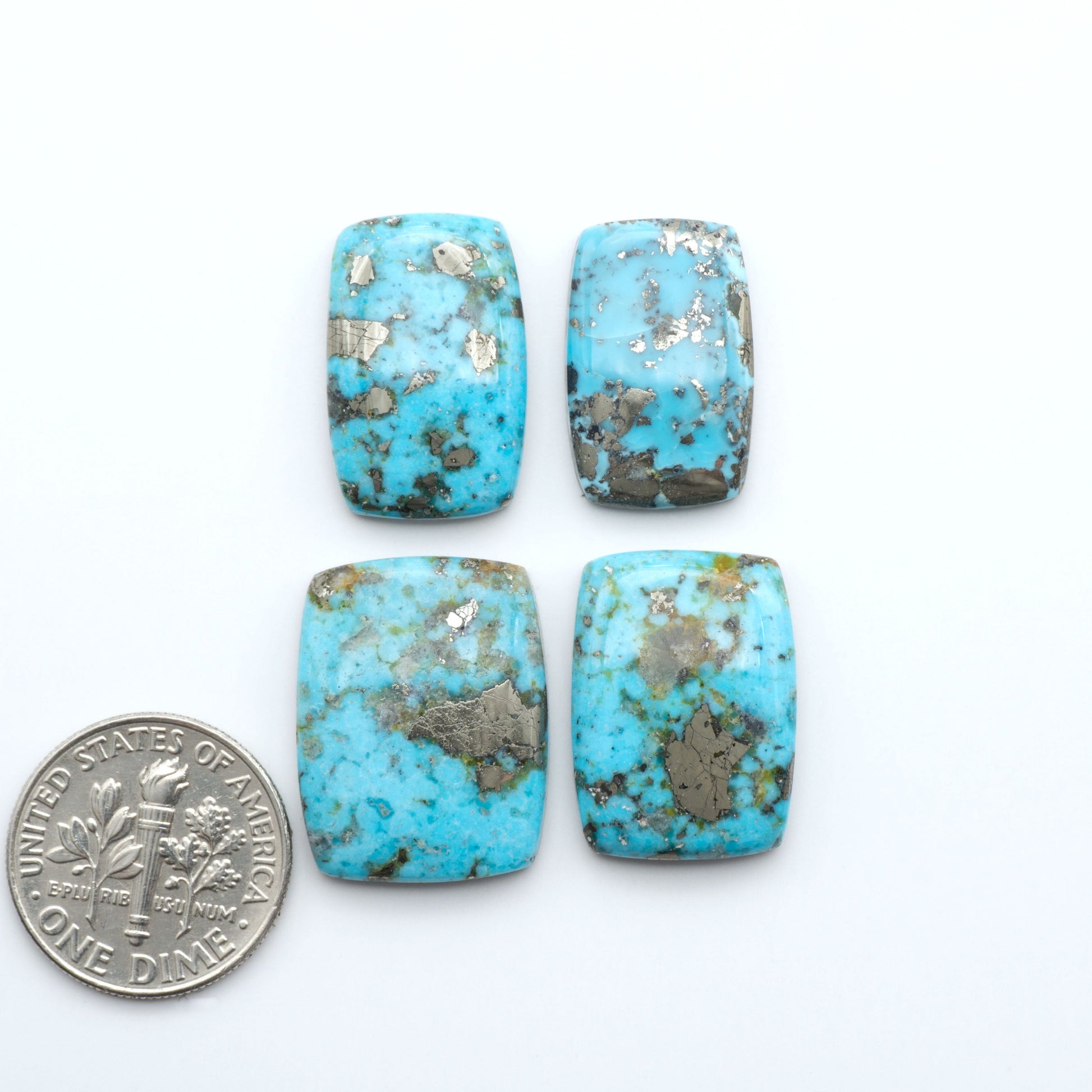 Nacozari turquoise cabochons are striking gemstones known for their vibrant blue to greenish-blue colors and pyrite, these stones are prized in jewelry making.