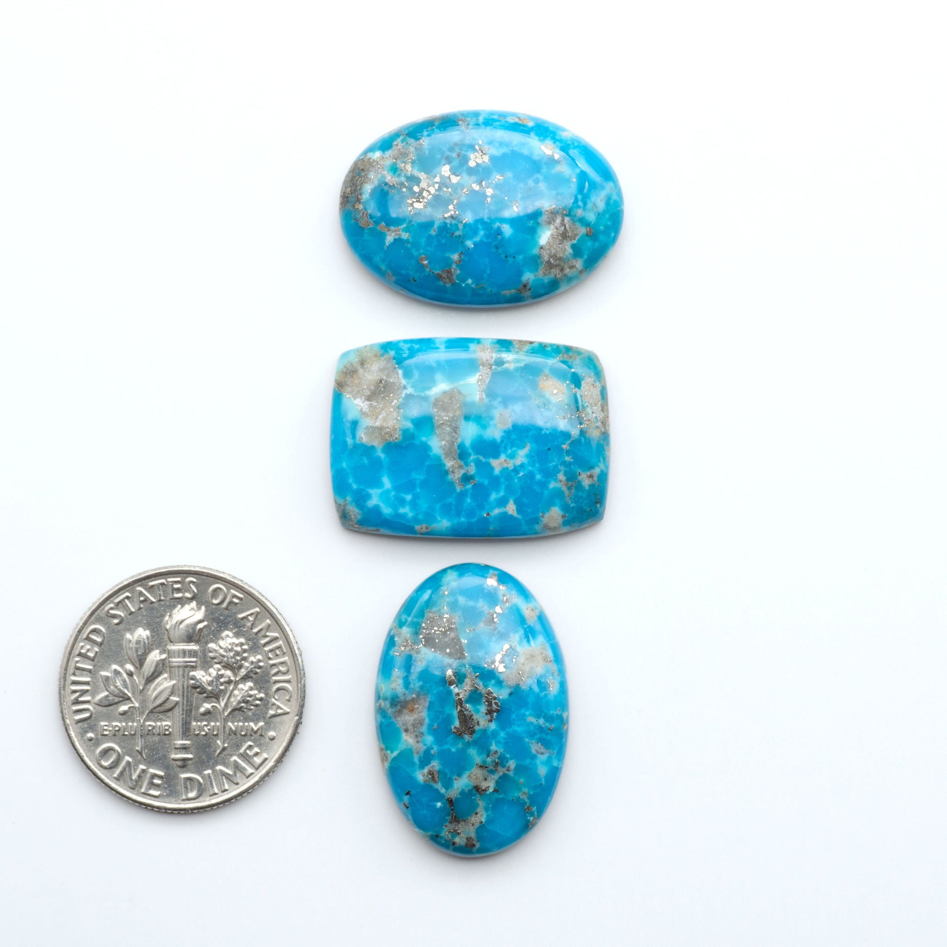 Nacozari turquoise cabochons are striking gemstones known for their vibrant blue to greenish-blue colors and pyrite, these stones are prized in jewelry making.