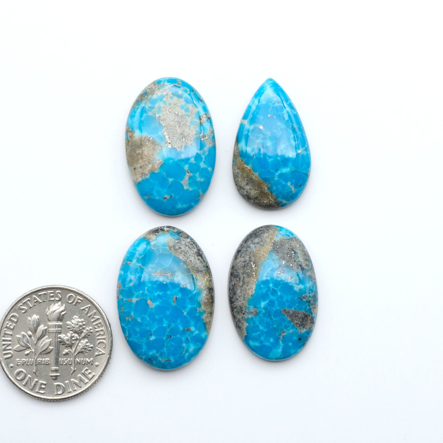 Nacozari turquoise cabochons are striking gemstones known for their vibrant blue to greenish-blue colors and pyrite, these stones are prized in jewelry making.