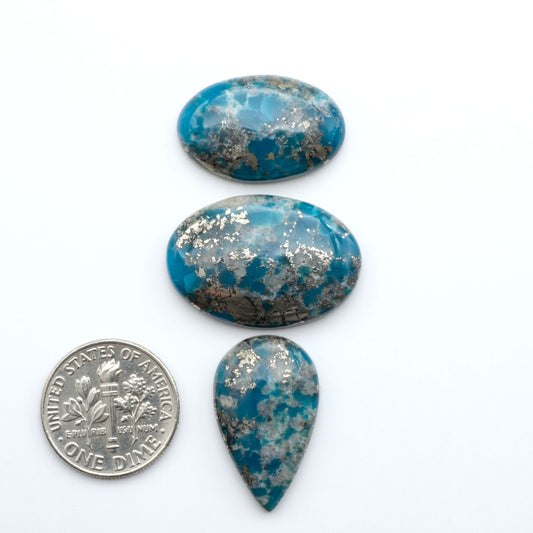 Nacozari turquoise cabochons are striking gemstones known for their vibrant blue to greenish-blue colors and pyrite, these stones are prized in jewelry making.