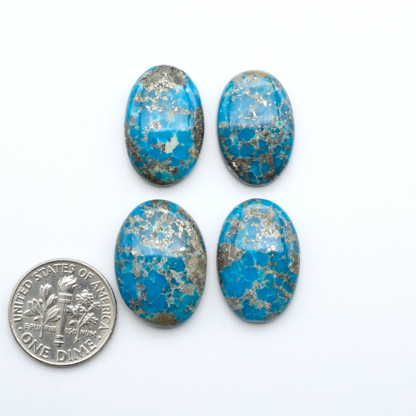 Nacozari turquoise cabochons are striking gemstones known for their vibrant blue to greenish-blue colors and pyrite, these stones are prized in jewelry making.