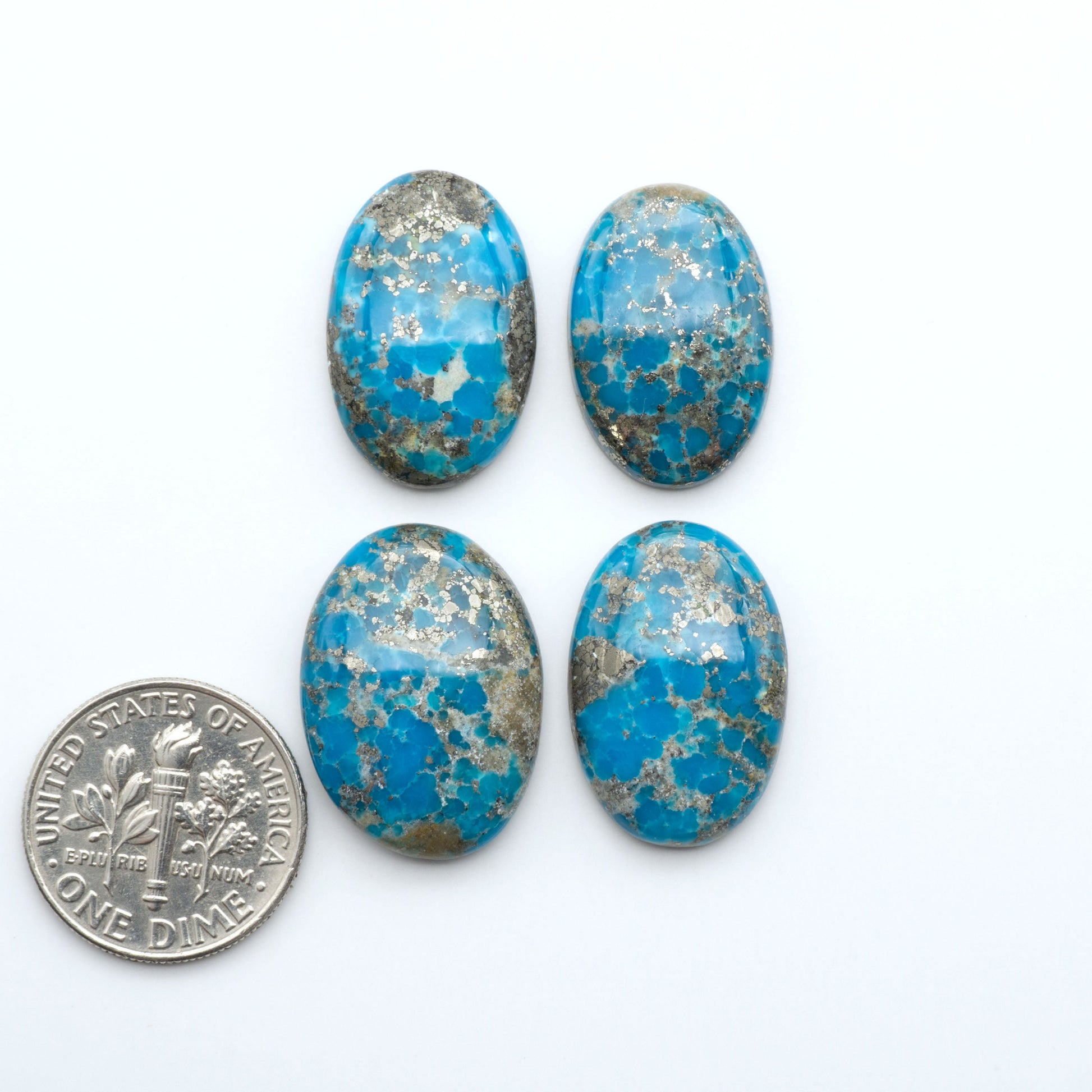 Nacozari turquoise cabochons are striking gemstones known for their vibrant blue to greenish-blue colors and pyrite, these stones are prized in jewelry making.
