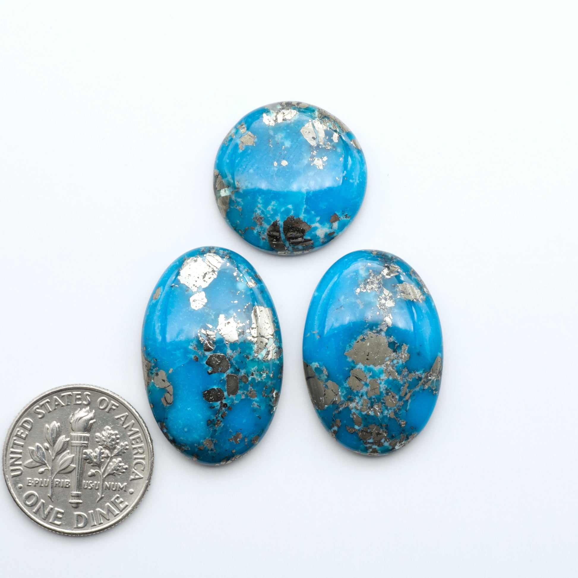 Nacozari turquoise cabochons are striking gemstones known for their vibrant blue to greenish-blue colors and pyrite, these stones are prized in jewelry making.